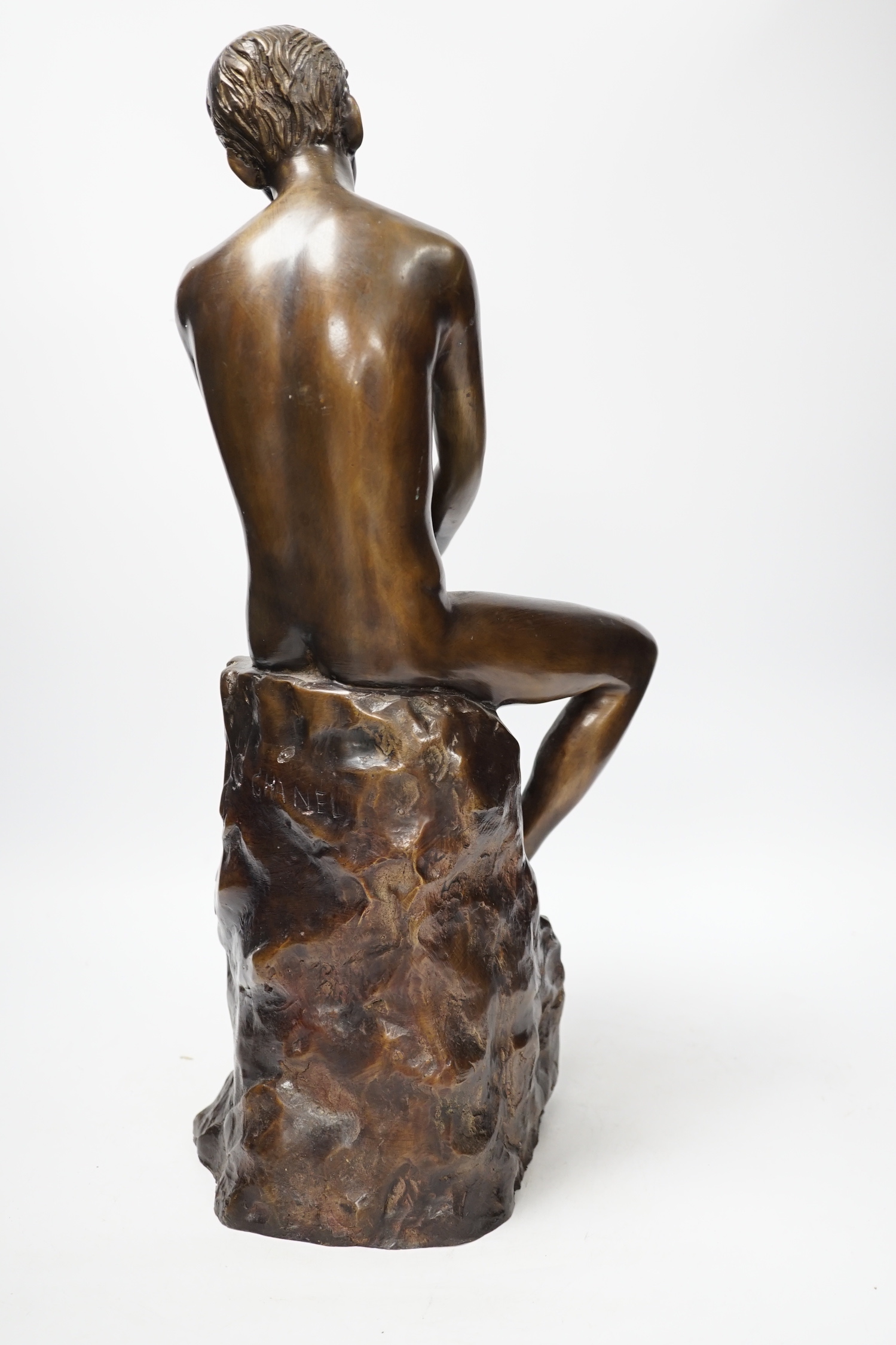 A bronze seated nude, 50cm